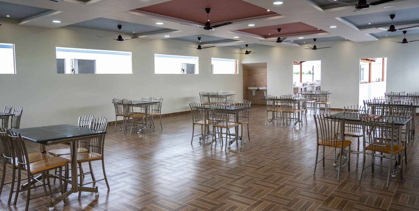 Wide view of the Bhojanalaya restaurant with high ceilings and generous natural light