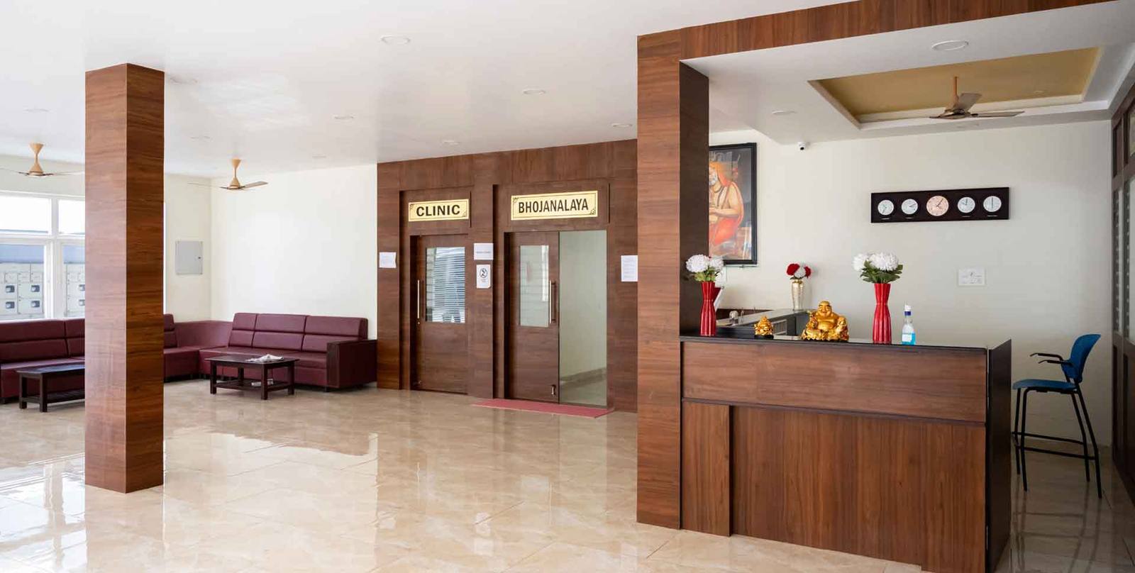 The Divine Inn reception lobby, with seating and the entrance to the Bhojanalaya restaurant